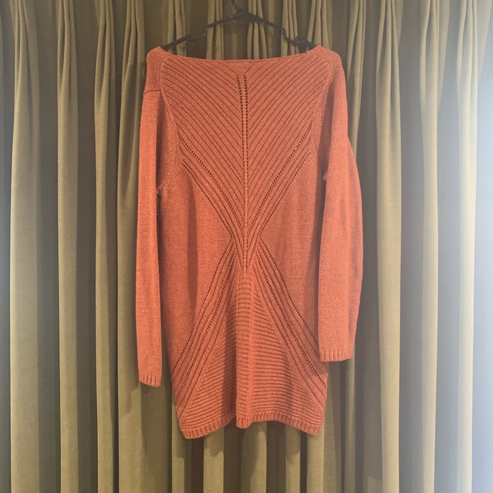 Women’s burnt orange sweater.